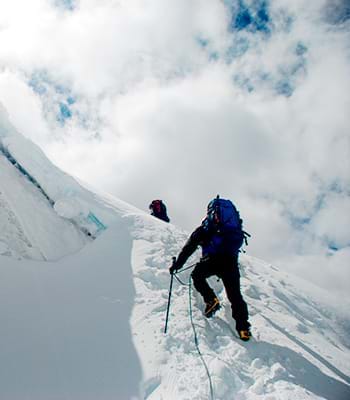 Tourist climbing the Cordillera de Huayhuash